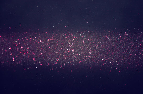 bokeh lights background with multi layers and colors of white silver and purple
