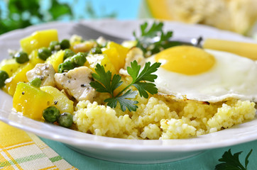 Healthy breakfast - couscous,vegetable ragout with chicken and f