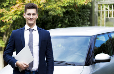 beautiful young insurance agent watching straight in camera