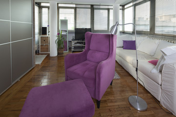 violet armchair in modern apartmet interior