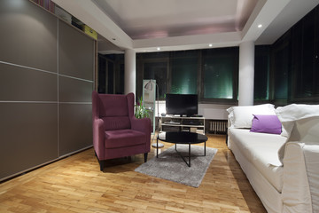 violet armchair in modern apartmet interior