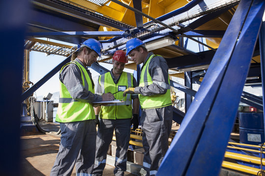 Crew onboard a ship inspecting with clipboard