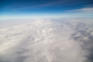 Fototapeta na wymiar blue sky high view from airplane clouds shapes