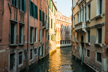 Fototapeta na wymiar Narrow canal among old houses, Venice, Italy.