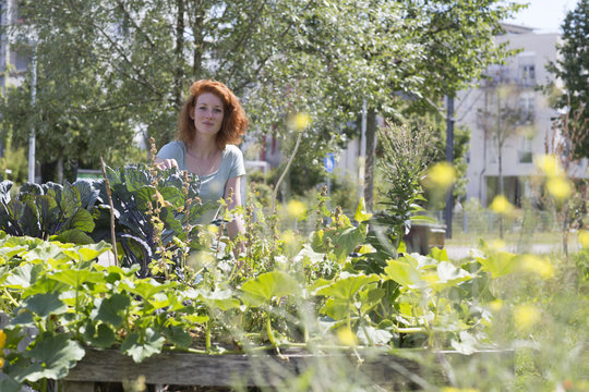 Young woman gardening, urban gardening