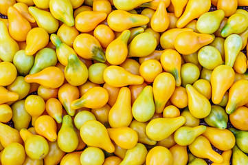 Ripe yellow tomatoes background