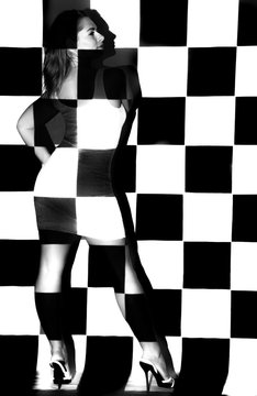 Fototapeta Beautiful woman covered with black and white squares