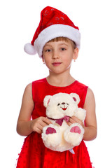 Girl in a red cap holding a toy in the hands, isolated