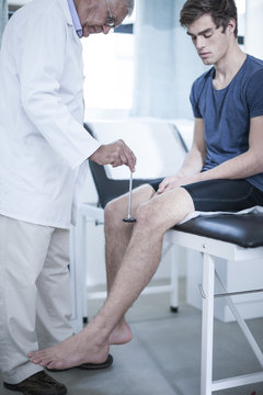 Doctor and patient with reflex hammer