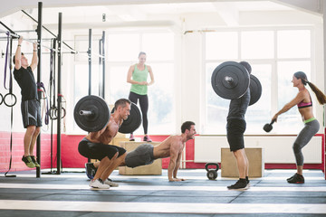 CrossFit athletes exercising in gym