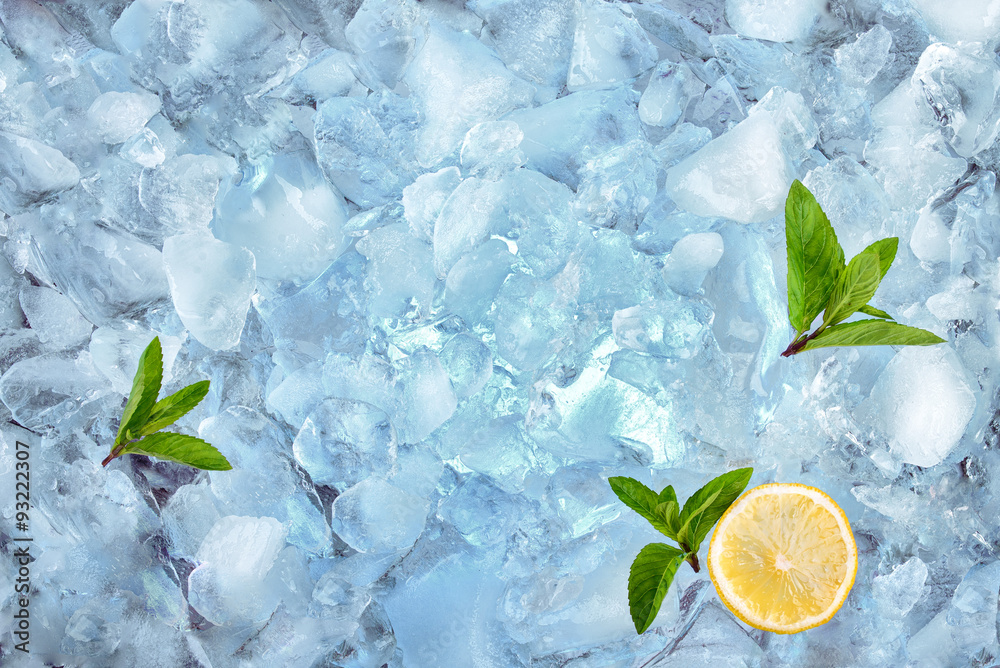 Wall mural background with ice cubes mint and lemon, top view