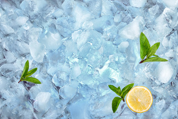 background with ice cubes mint and lemon, top view