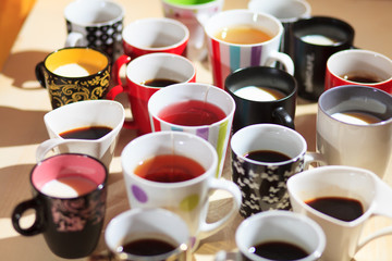 Fototapeta na wymiar tea, coffee and milk in cups from above
