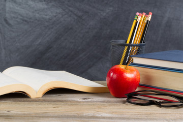 Desktop with reading materials and blackboard