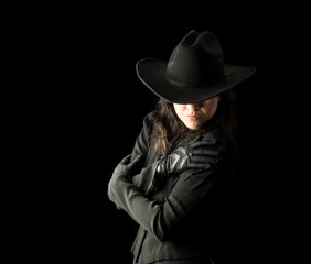Fototapeta premium Woman in Black Wearing Cowboy Hat