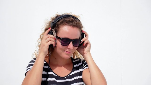 THAILAND, KOH SAMUI, DECEMBER 2014 - Girl Listening Music in