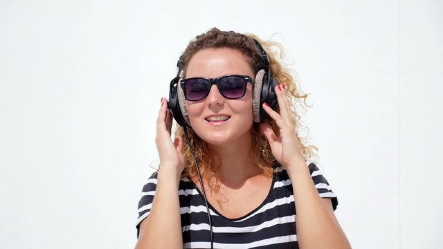 Woman Listening to Music in Professional Headphones. Slow Motion