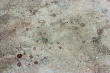 The cement floor, blood stains