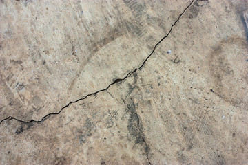 Cement floors are old and dirty.