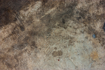 Cement floors are old and dirty.