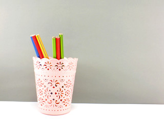 colorful holder full of pen and pencil office equipment for eduation or business still life