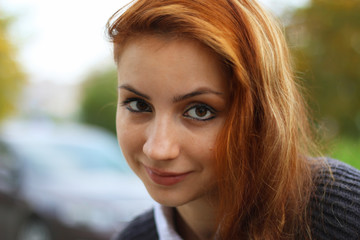 red-haired girl in autumn jacket