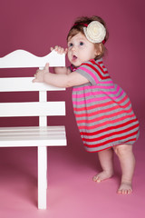 Little kid with decoration in studio