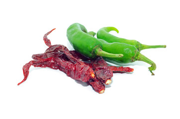 dry chillies and Green hot peppers isolated on white