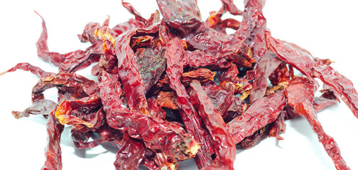 Red dry chilli peppers on white background