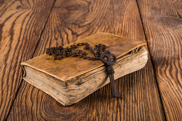 Old key with book