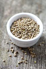 hemp seeds on wooden surface