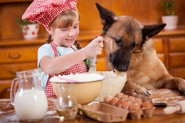 funny picture of a little girl that blurs  the dough ,and German