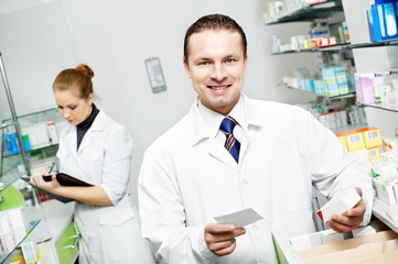 pharmacy chemist man in drugstore