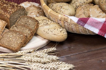Wholemeal bread and pastries on a wooden table