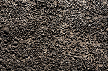 Old black plaster wall texture.