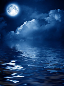 moon with nightly clouds over the water