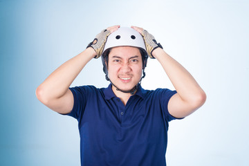Asian guy with bicycle helmet and gloves