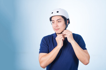 Asian guy with bicycle helmet and gloves