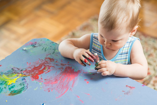 Kids Hand Messed With Colorful Paint