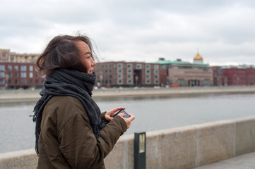 Girl with the phone smiling