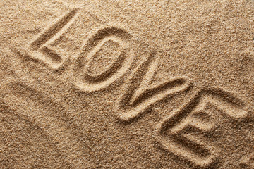 Fototapeta na wymiar Love written on sand