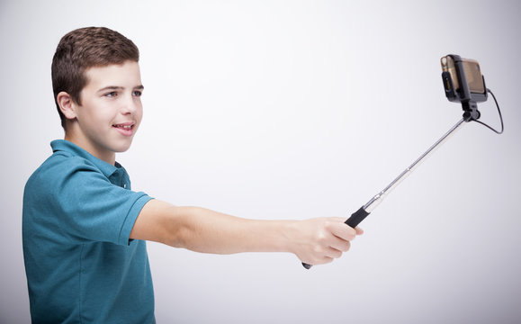 Teen Boy Using A Selfie Stick