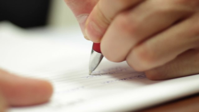 Hand writing note pen paper