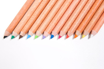 Close up view of different color pencils isolated on the white b