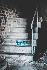 Creepy staircase in abandoned warehouse