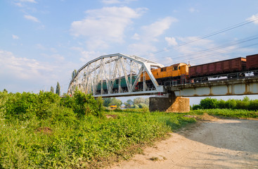 Fototapeta premium Freight train on the bridge