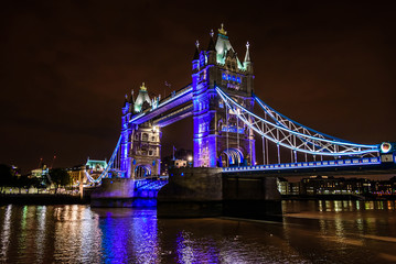 Tower Bridge at night over the River Thames, London, UK, England