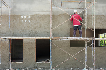 plasterer cement concrete man worker stand on scaffold steel