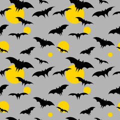 Obraz premium Vector seamless halloween pattern with bat and moons. Festive wrapper. Background.