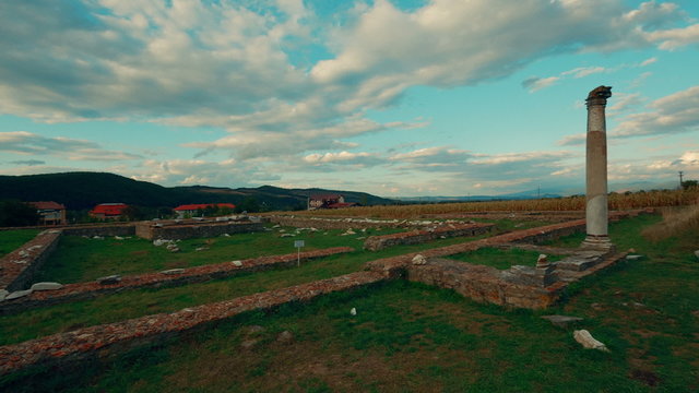 An ultrawide establishing shot of the Roman ruins of Sarmizegetusa in Deva, Romania
